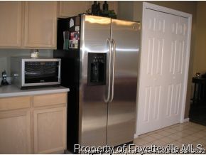 6435 Applewhite Road Fayetteville, NC 28304 - Photo 4 of 10 a kitchen with a refrigerator and cabinets