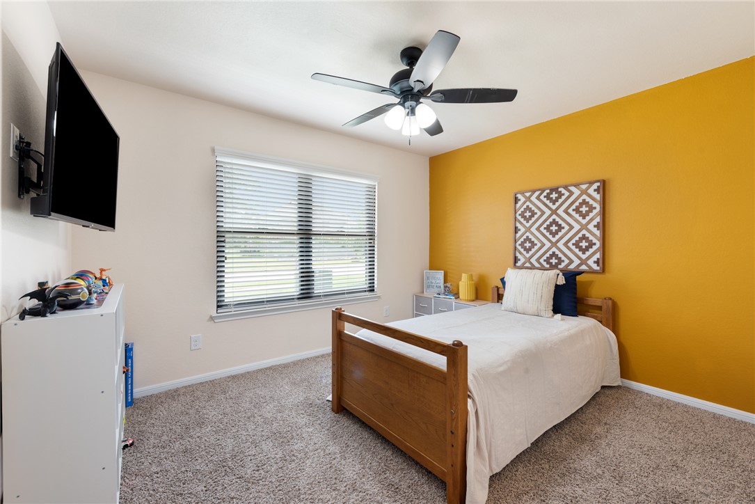 2018 Eagle View Drive Navasota, TX 77868 - Photo 23 of 28 a bedroom with a bed and a flat screen tv