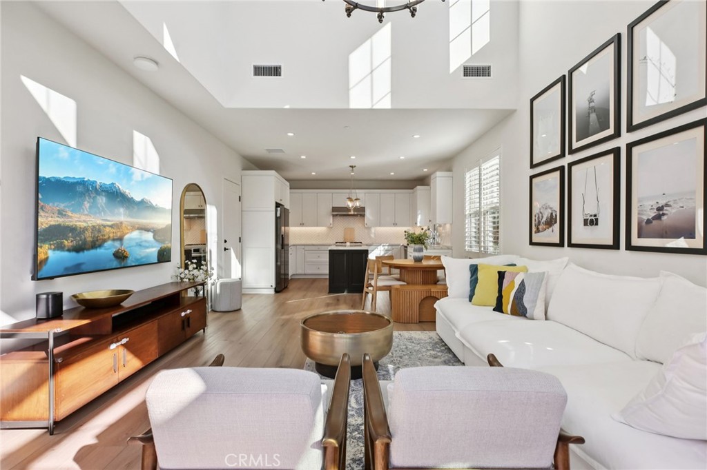 151 Soaring Eagle Irvine, CA 92618 - Photo 12 of 57 a living room with furniture and a flat screen tv