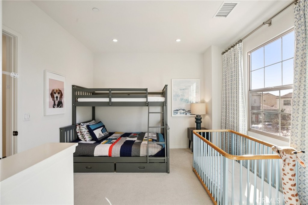 151 Soaring Eagle Irvine, CA 92618 - Photo 16 of 57 a bedroom with furniture and windows