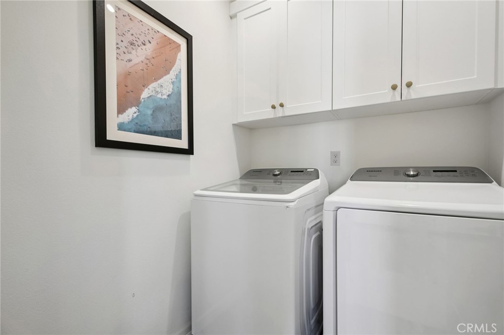 151 Soaring Eagle Irvine, CA 92618 - Photo 18 of 57 a utility room with dryer and washer