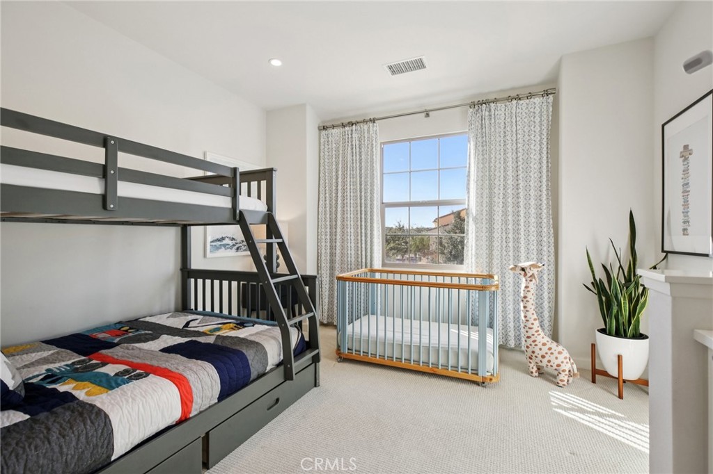 151 Soaring Eagle Irvine, CA 92618 - Photo 19 of 57 a bed sitting in a bedroom next to a window