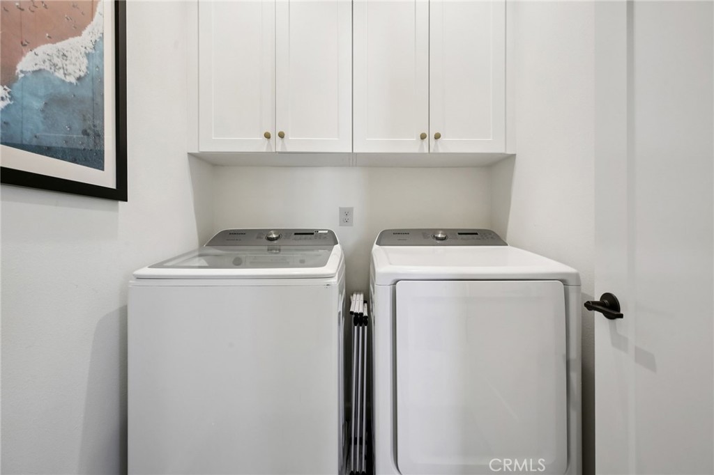 151 Soaring Eagle Irvine, CA 92618 - Photo 22 of 57 a utility room with dryer and washer