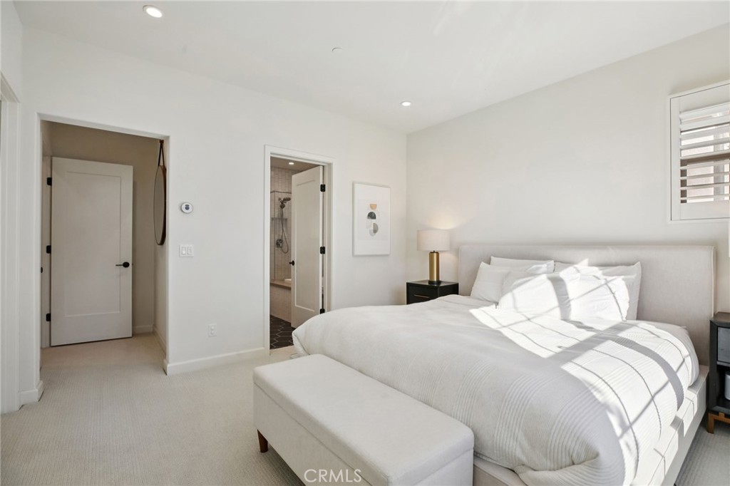 151 Soaring Eagle Irvine, CA 92618 - Photo 24 of 57 a bedroom with a bed and a night stand
