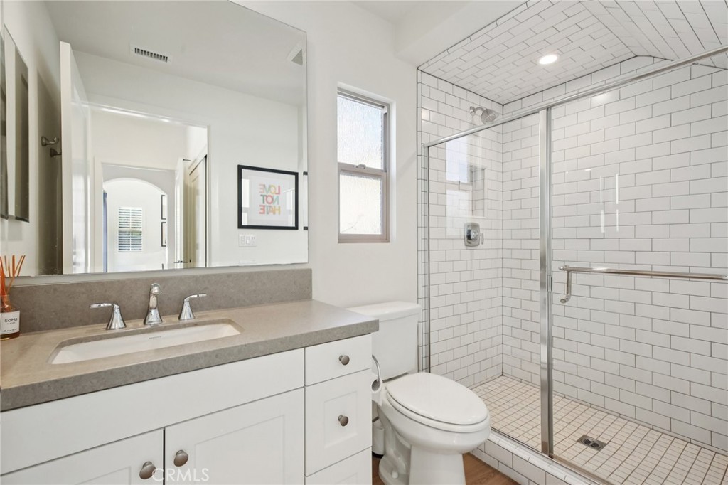 151 Soaring Eagle Irvine, CA 92618 - Photo 25 of 57 a bathroom with a granite countertop sink toilet and shower