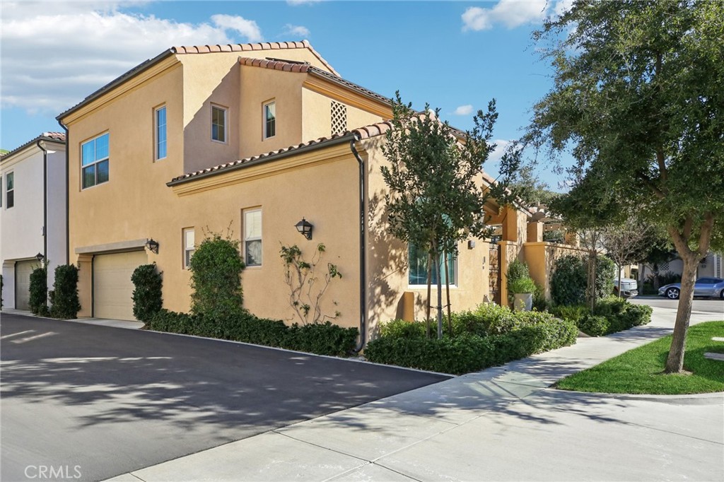 151 Soaring Eagle Irvine, CA 92618 - Photo 38 of 57 a front view of a house with a yard and garage