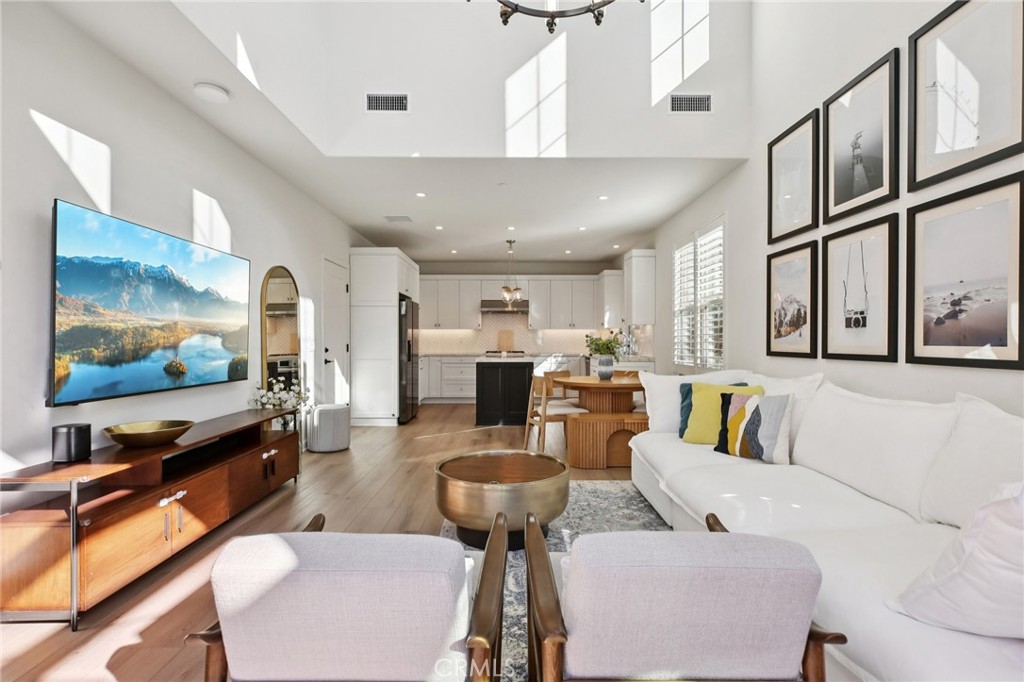 151 Soaring Eagle Irvine, CA 92618 - Photo 39 of 57 a living room with furniture and a flat screen tv