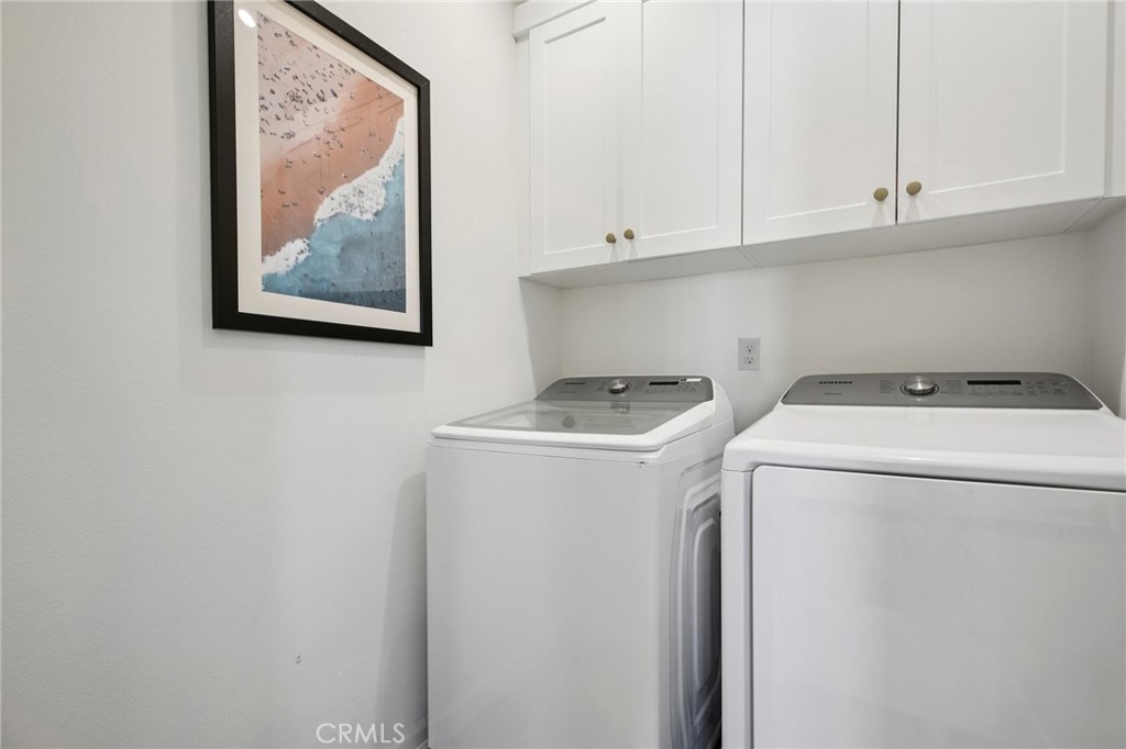 151 Soaring Eagle Irvine, CA 92618 - Photo 42 of 57 a utility room with dryer and washer