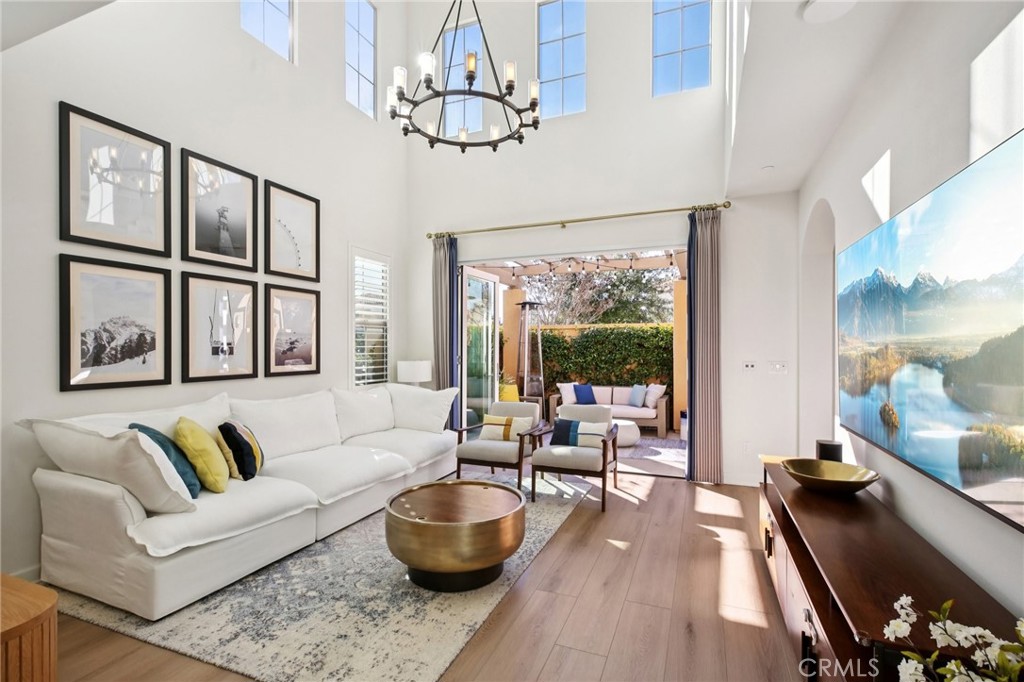 151 Soaring Eagle Irvine, CA 92618 - Photo 5 of 57 a living room with furniture and a chandelier