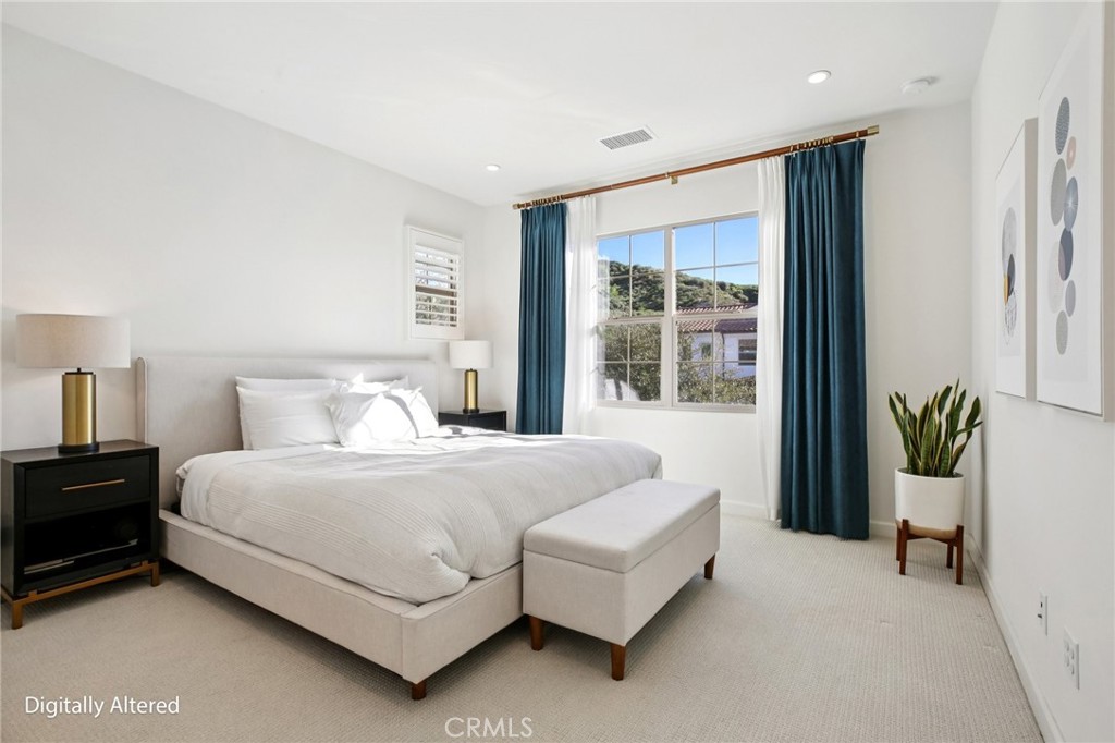 151 Soaring Eagle Irvine, CA 92618 - Photo 54 of 57 a bedroom with a large bed and a large window