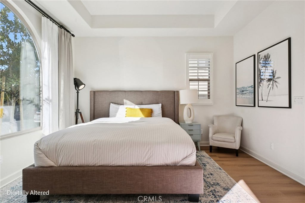 151 Soaring Eagle Irvine, CA 92618 - Photo 55 of 57 a bedroom with a bed and wooden floor