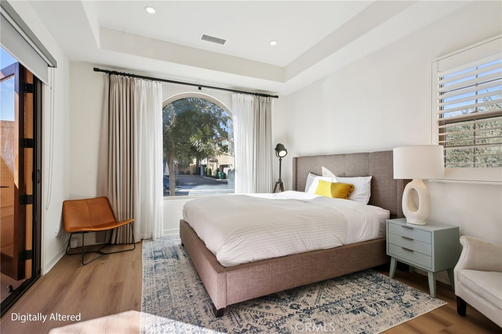 151 Soaring Eagle Irvine, CA 92618 - Photo 56 of 57 a bedroom with a bed a lamp and a large window