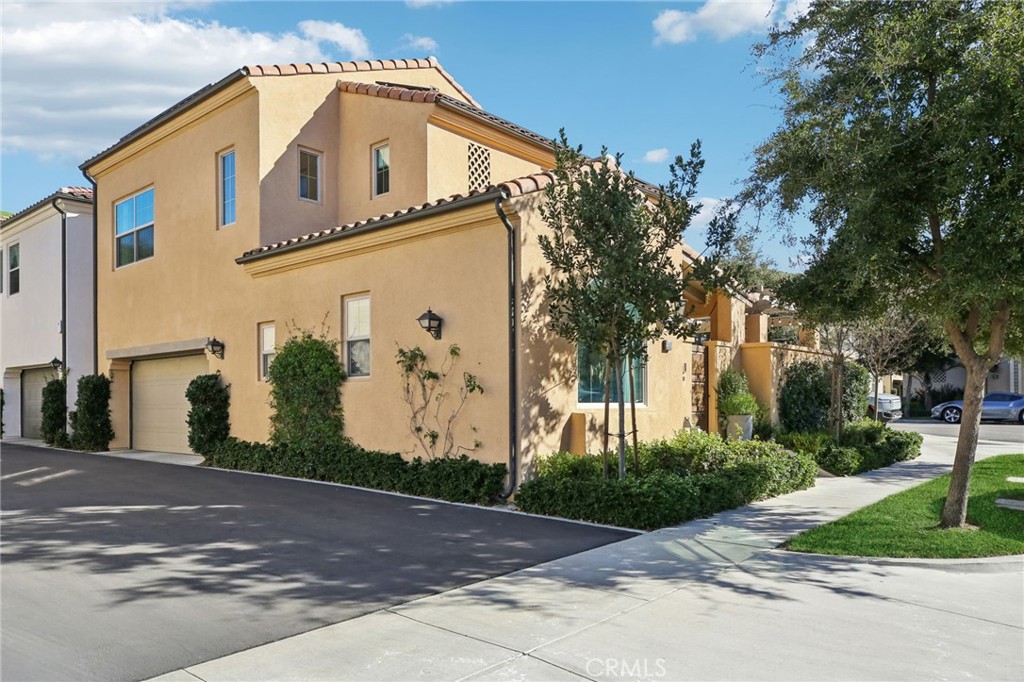 151 Soaring Eagle Irvine, CA 92618 - Photo 6 of 57 a front view of a house with a yard and garage