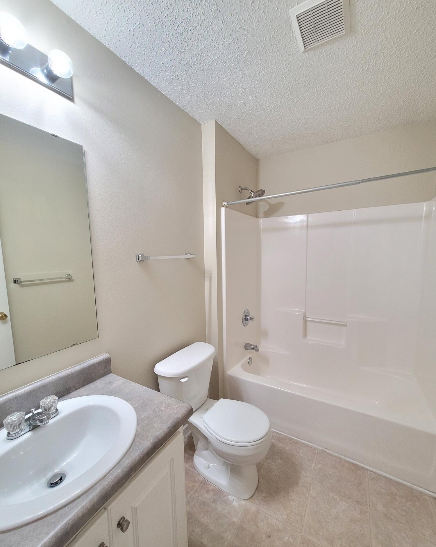 268 Limestone Circle Crestview, FL 32539 - Photo 13 of 23 a bathroom with a sink toilet and shower