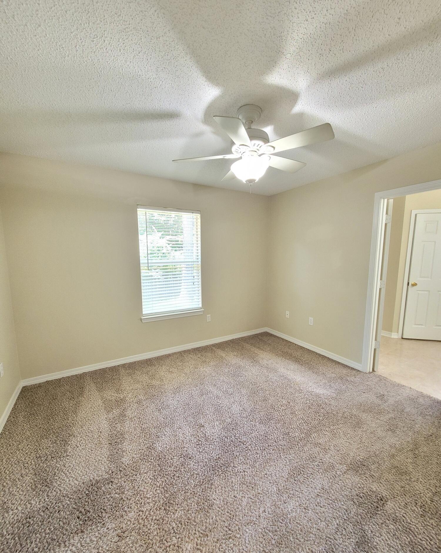 268 Limestone Circle Crestview, FL 32539 - Photo 15 of 23 a view of an empty room with a window