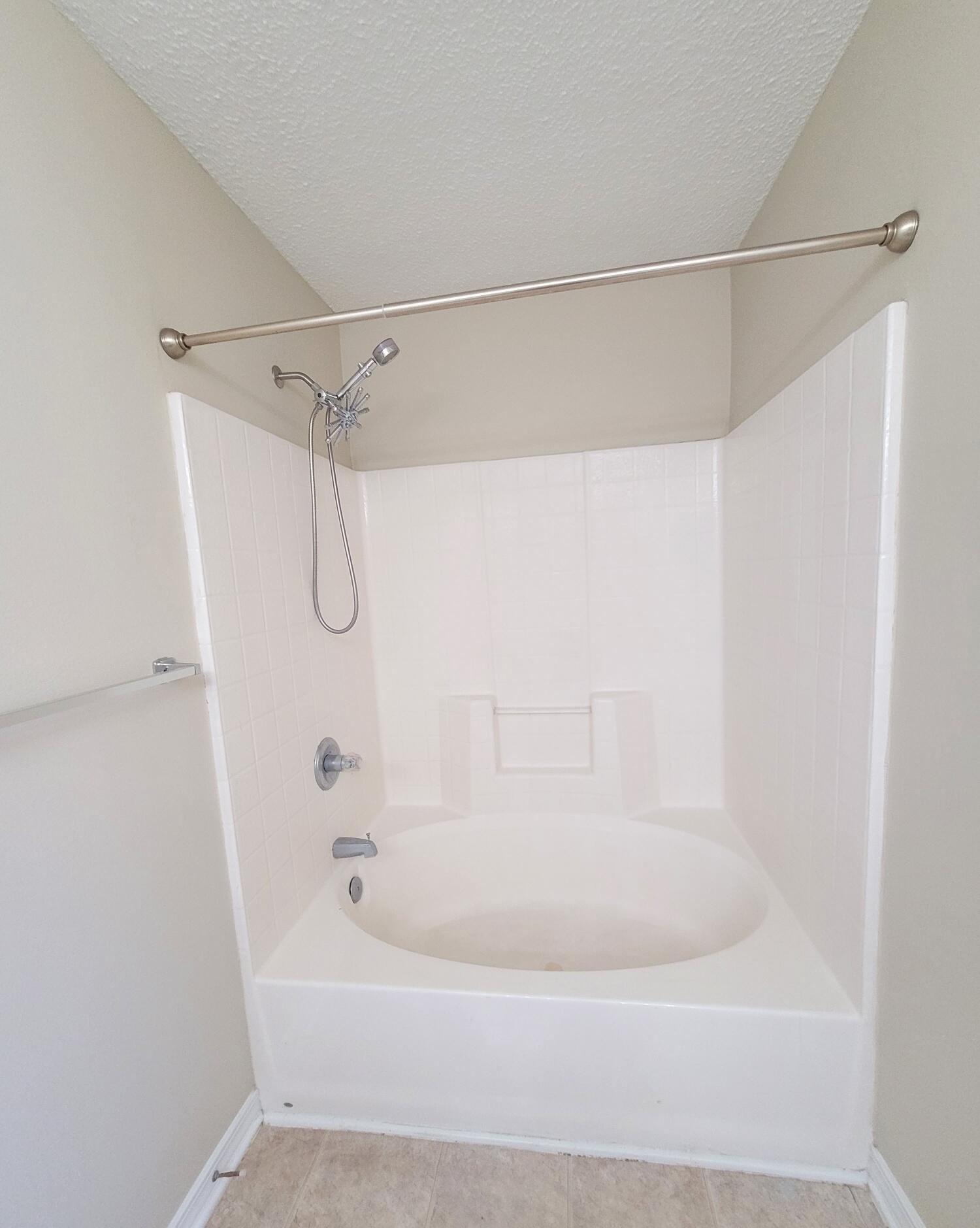 268 Limestone Circle Crestview, FL 32539 - Photo 17 of 23 a white bath tub with a shower in it