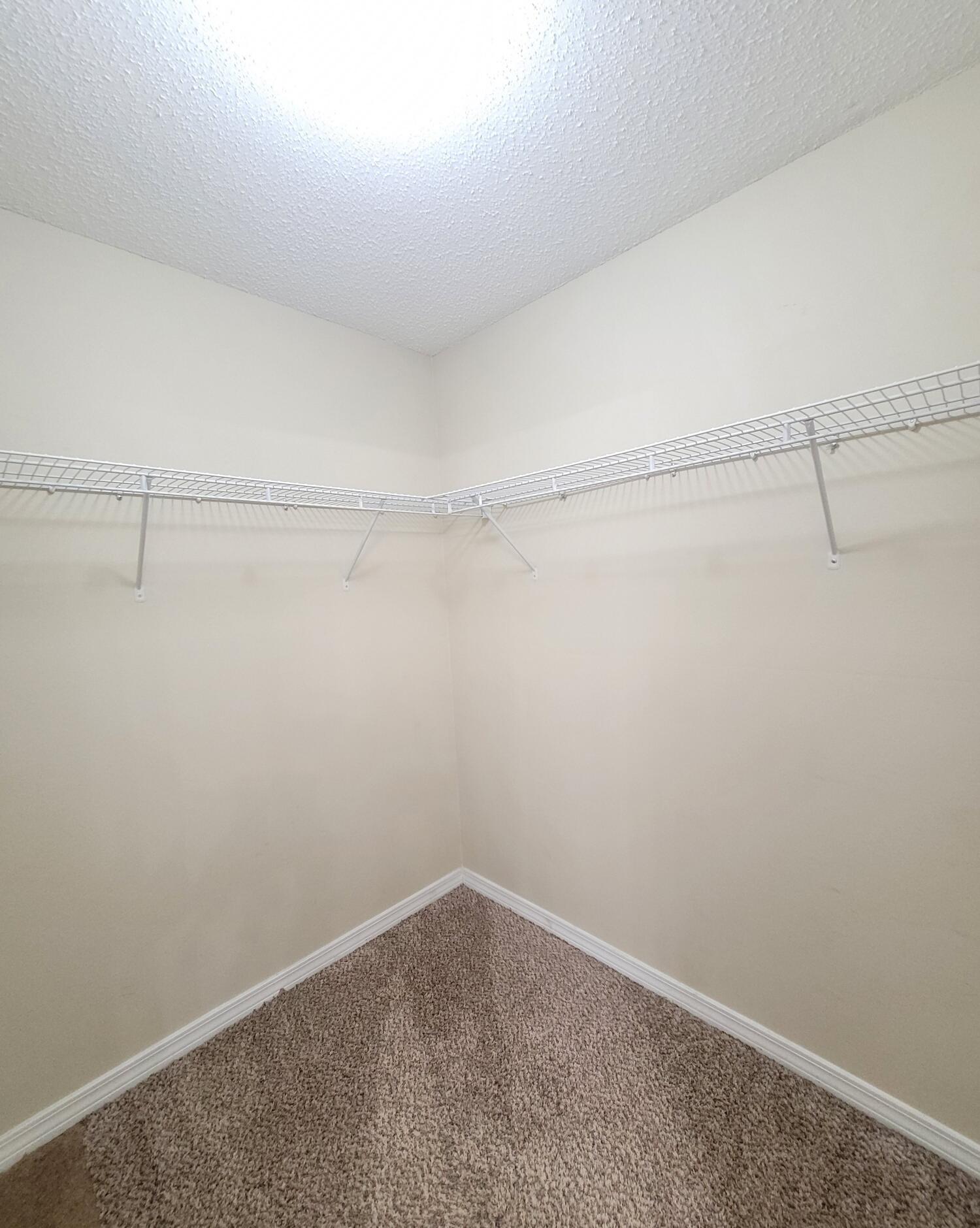 268 Limestone Circle Crestview, FL 32539 - Photo 18 of 23 a view of a room with racks on the wall