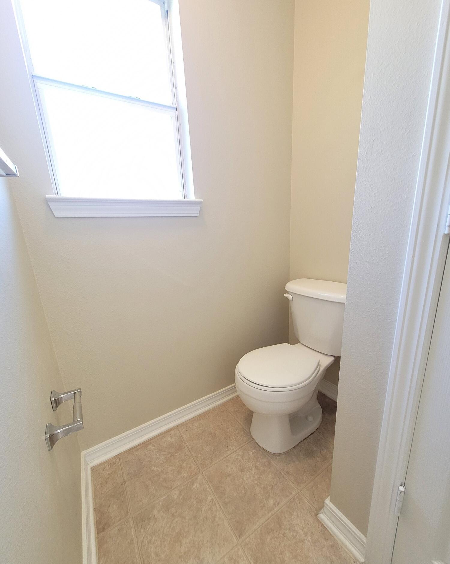 268 Limestone Circle Crestview, FL 32539 - Photo 19 of 23 a white toilet sitting next to a window
