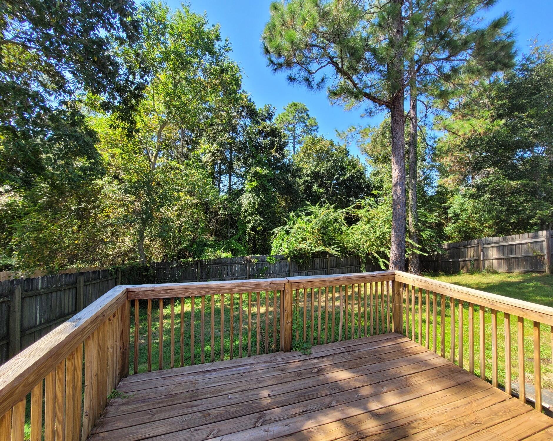 268 Limestone Circle Crestview, FL 32539 - Photo 22 of 23 a balcony with trees in front of it