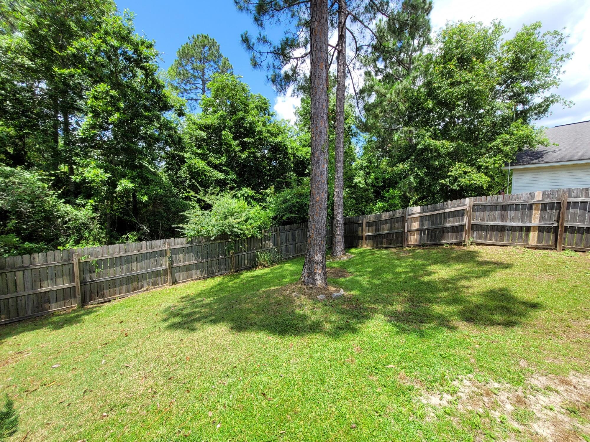 268 Limestone Circle Crestview, FL 32539 - Photo 23 of 23 a view of a yard with a large tree