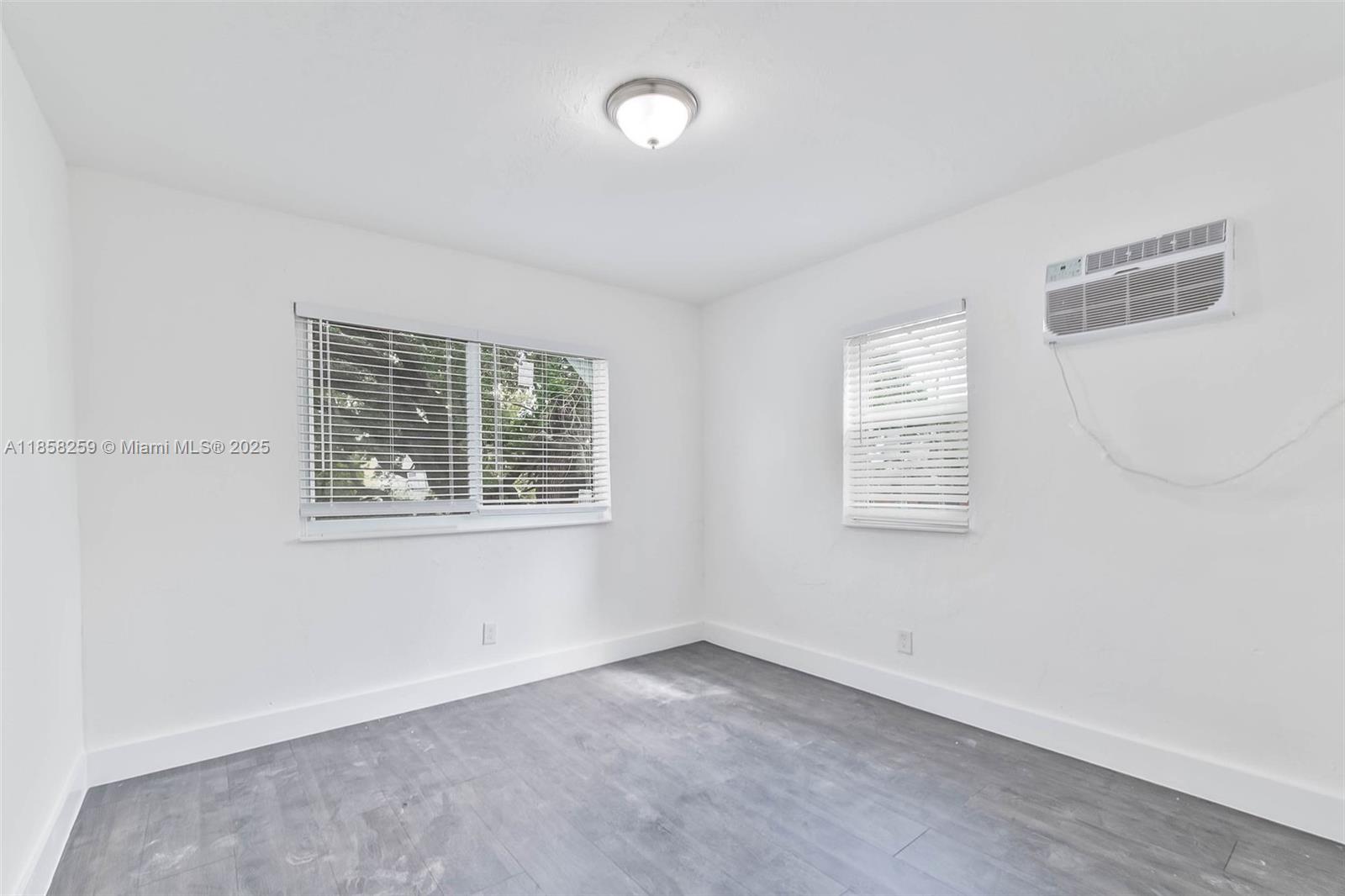 212 Northwest 15th Street, Unit 2 Miami, FL 33136 - Photo 11 of 19 an empty room with windows