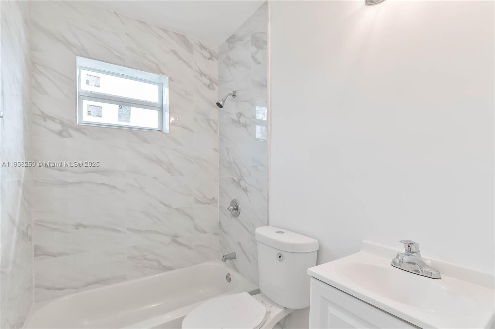 212 Northwest 15th Street, Unit 2 Miami, FL 33136 - Photo 12 of 19 a bathroom with a sink and a toilet