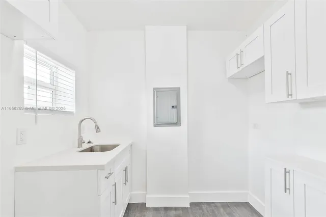 a bathroom with a sink a mirror and vanity