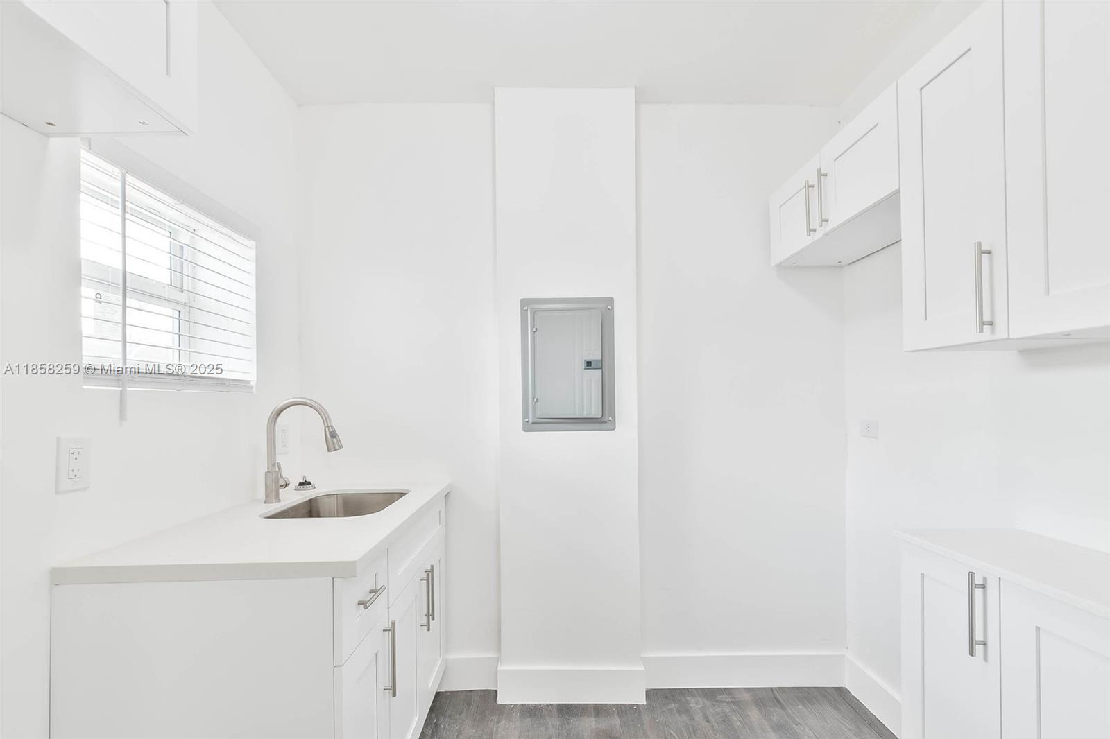 212 Northwest 15th Street, Unit 2 Miami, FL 33136 - Photo 14 of 19 a bathroom with a sink a mirror and vanity