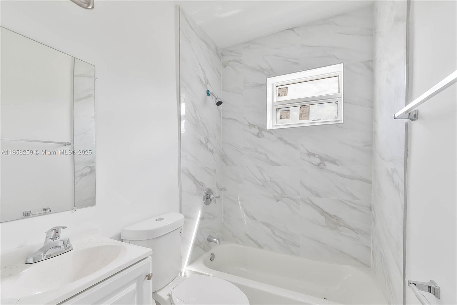 212 Northwest 15th Street, Unit 2 Miami, FL 33136 - Photo 15 of 19 a bathroom with a sink toilet and shower