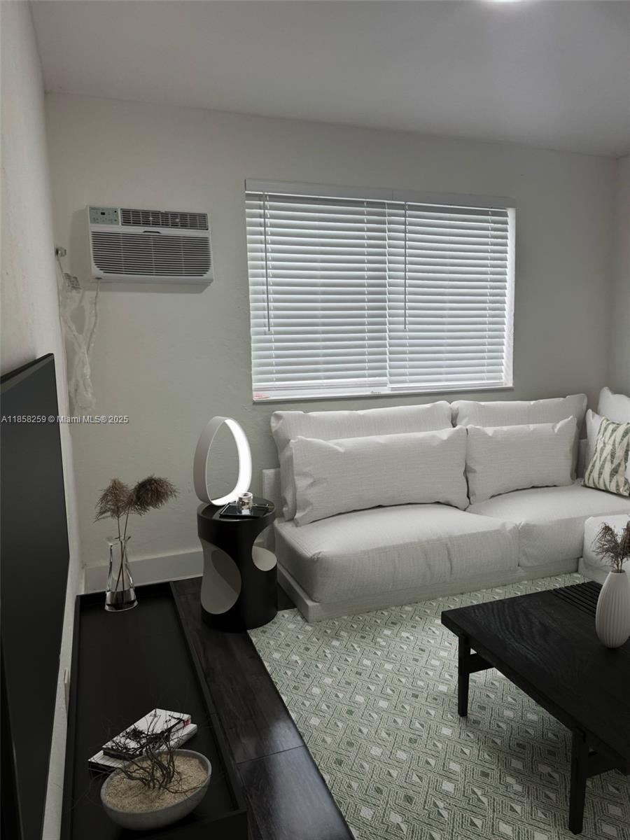 212 Northwest 15th Street, Unit 2 Miami, FL 33136 - Photo 3 of 19 a living room with furniture and a window