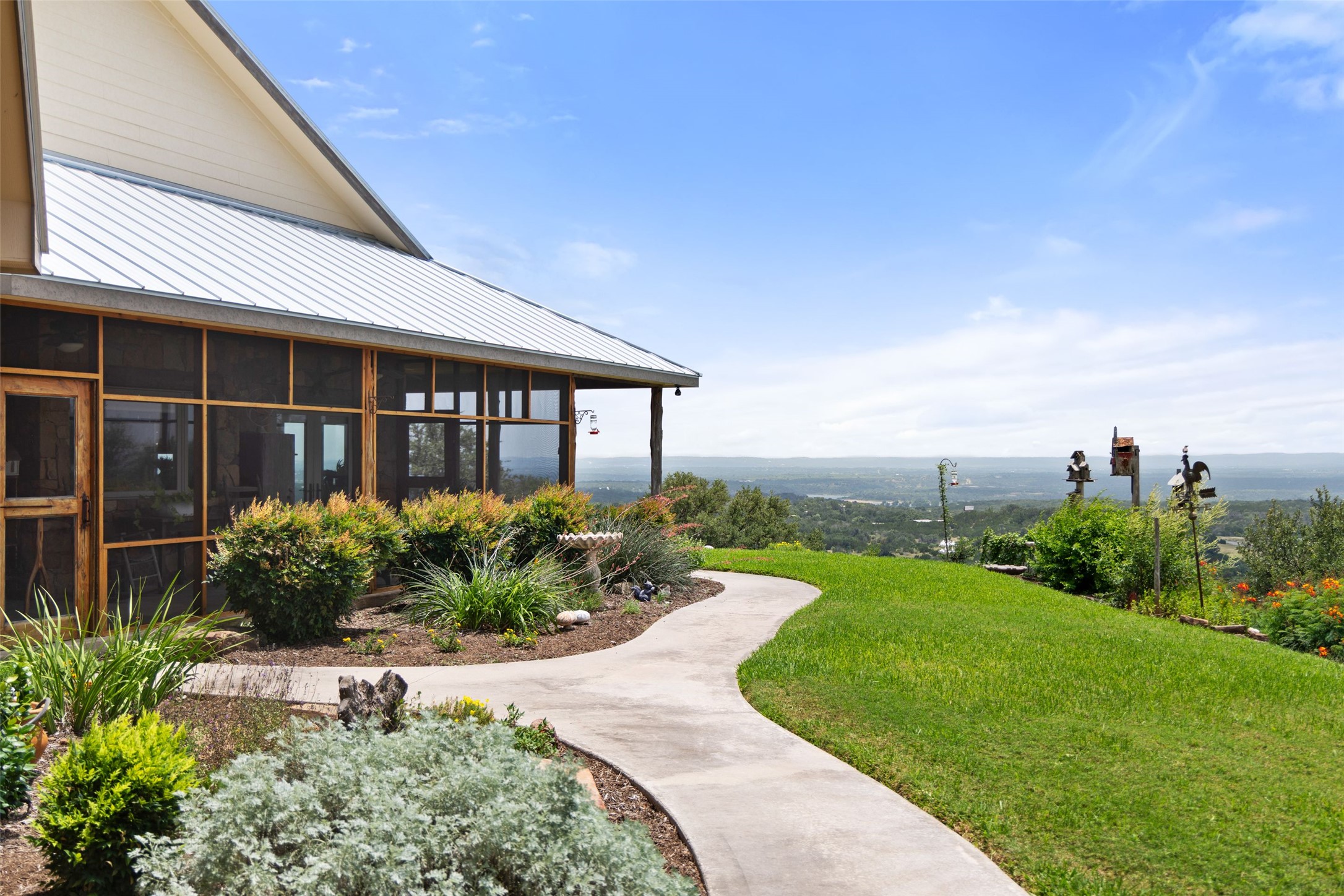 8400 Ranch Road 1431 Marble Falls, TX 78654 - Photo 12 of 30 Perched hillside, this home offers an exceptional panoramic vista from its screened-in porch and manicured grounds.