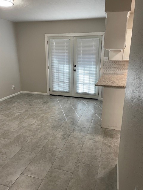 407 West Semands Street Conroe, TX 77301 - Photo 12 of 28 a view of an empty room with cabinet and door