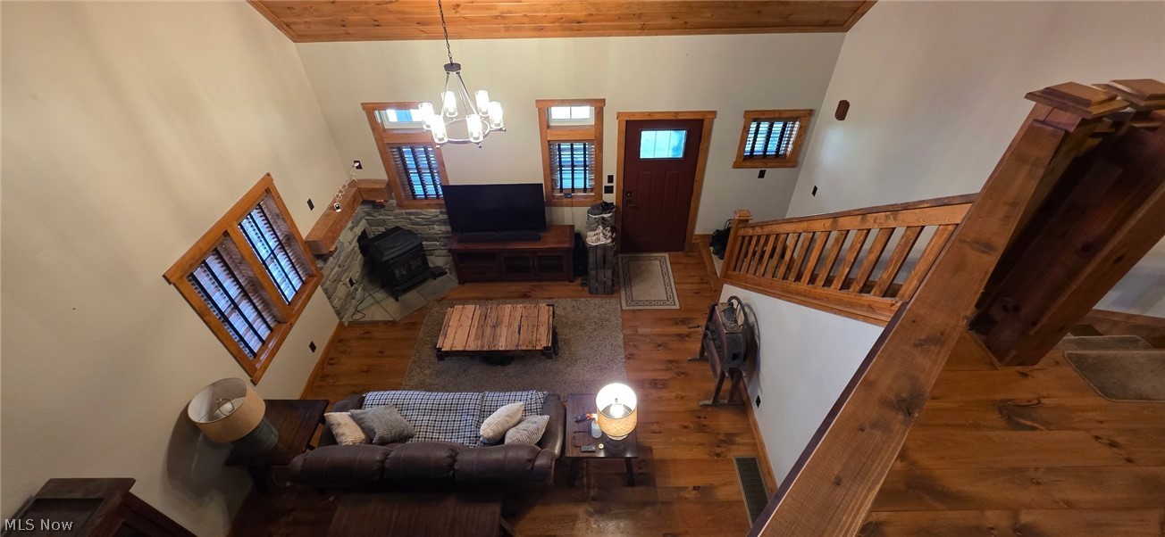 3989 Court Road Wakeman, OH 44889 - Photo 4 of 36 Living area with hardwood / wood-style floors, a high wood ceiling, and hanging lights