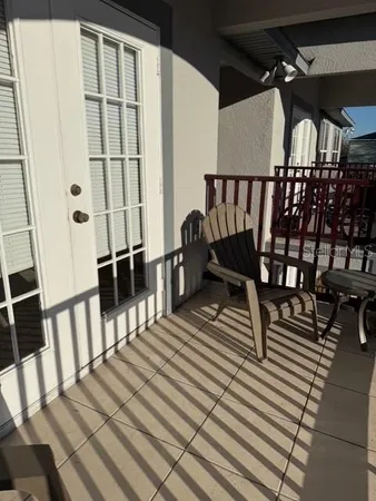 a view of a balcony with chairs