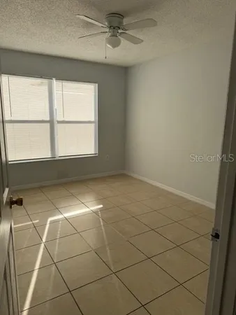 an empty room with a empty space and a window