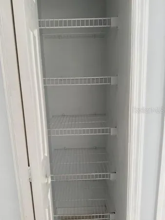a view of a room with racks on the wall