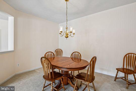 9511 Kingscroft Terrace, Unit 9511F Perry Hall, MD 21128 - Photo 13 of 38 a view of a dining room with furniture