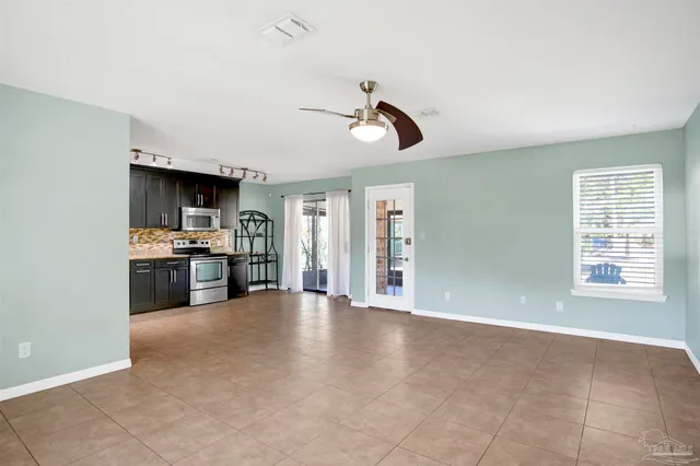 a view of a kitchen with a stove cabinets and a kitchen