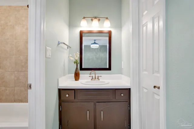 a bathroom with a sink and a mirror