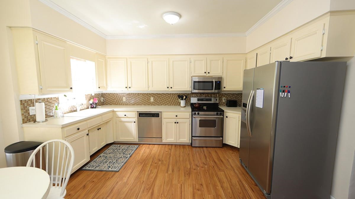 7614 Wilderness Road Raleigh, NC 27613 - Photo 3 of 25 Enjoy the bright natural light while sitting in the breakfast nook. Kitchen