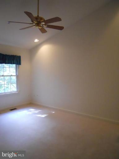 11205 Watermill Lane Silver Spring, MD 20902 - Photo 9 of 12 an empty room with a fan & a window