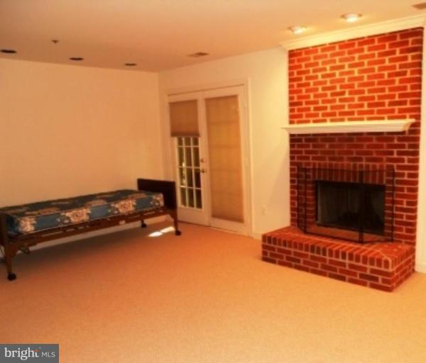 11205 Watermill Lane Silver Spring, MD 20902 - Photo 10 of 12 an empty room with a fireplace