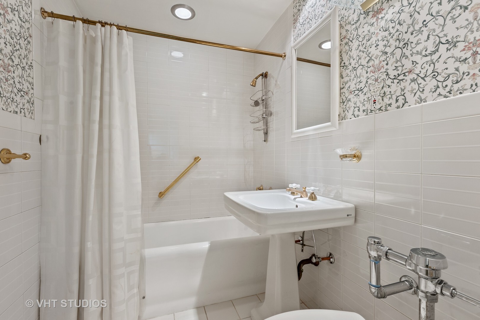 220 East Walton Place, Unit 9W Chicago, IL 60611 - Photo 13 of 22 a bathroom with a sink a mirror and a shower