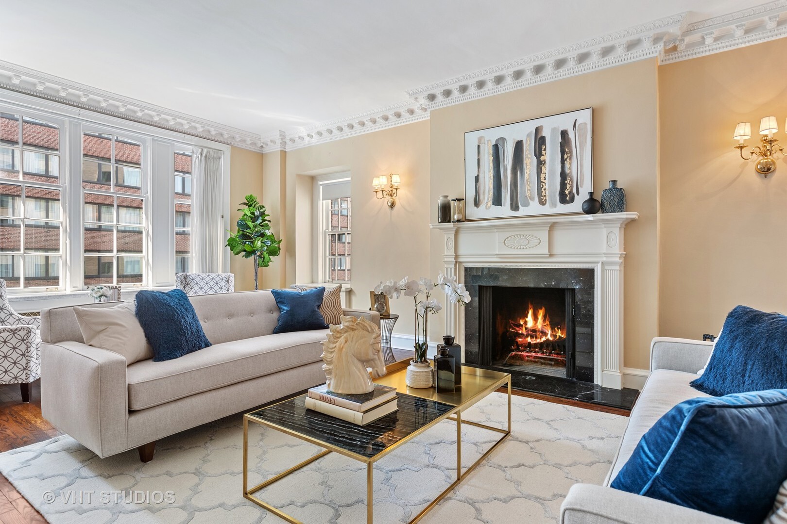 220 East Walton Place, Unit 9W Chicago, IL 60611 - Photo 5 of 22 a living room with furniture and a fireplace