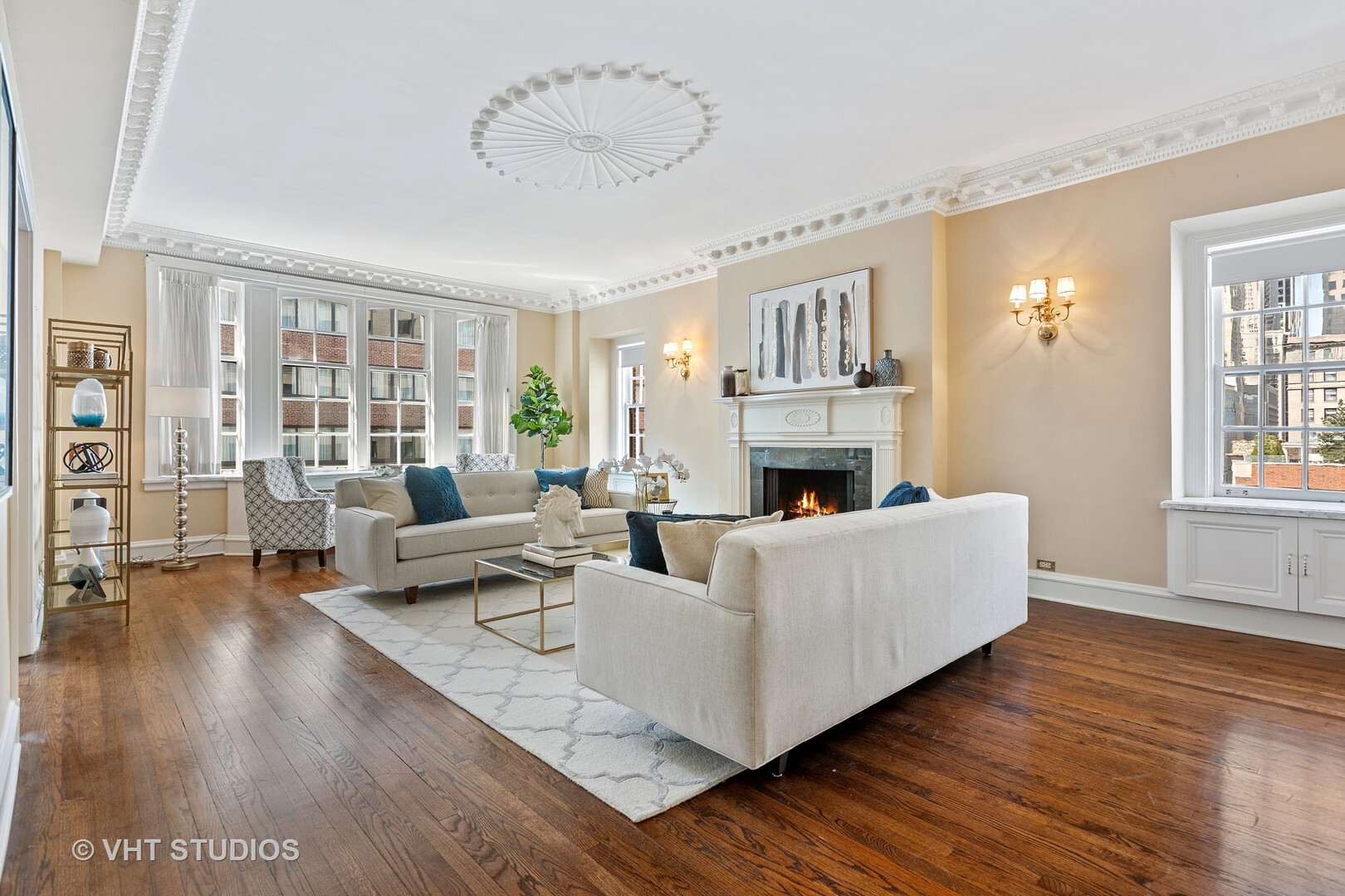 220 East Walton Place, Unit 9W Chicago, IL 60611 - Photo 6 of 22 a living room with furniture and a fireplace