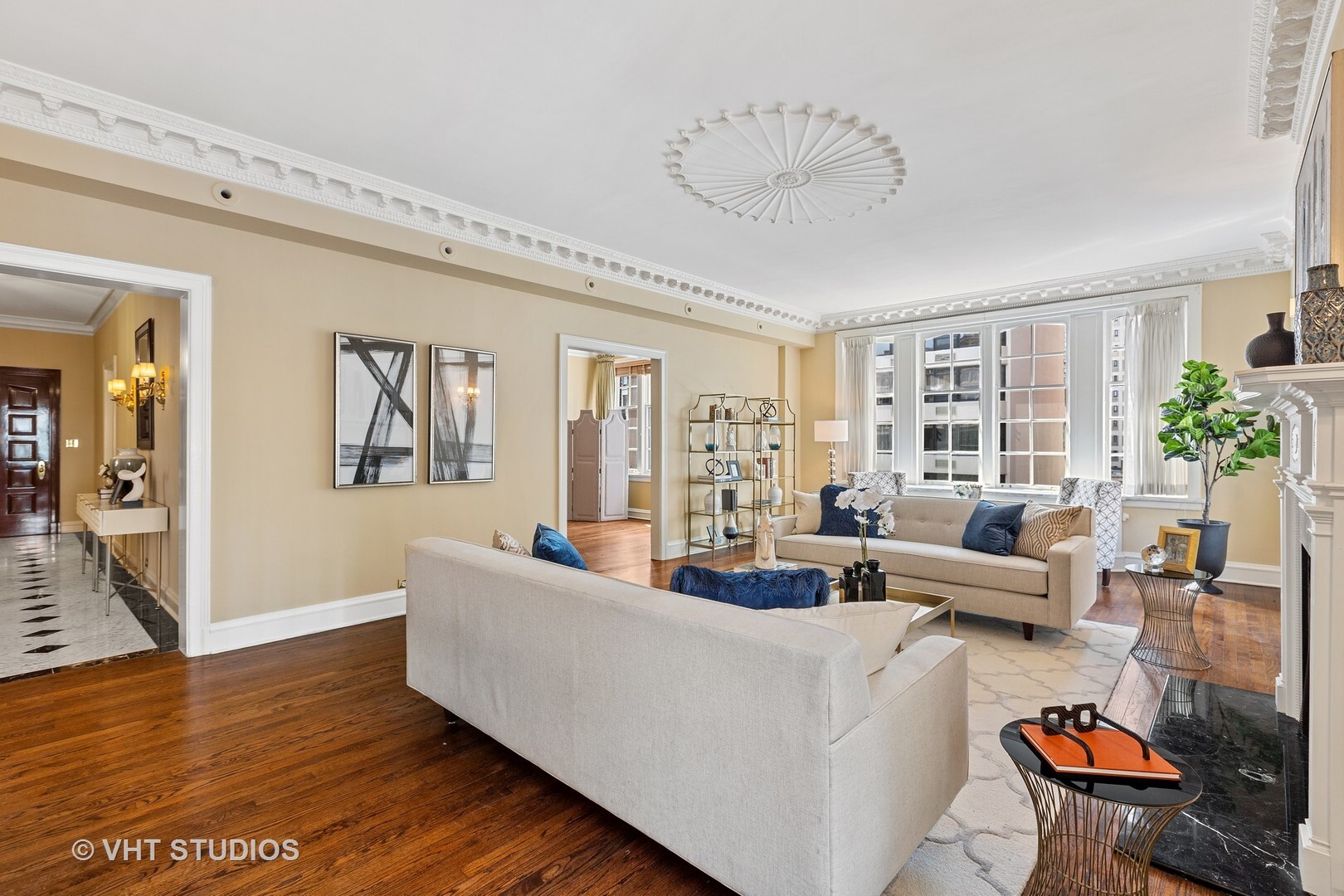 220 East Walton Place, Unit 9W Chicago, IL 60611 - Photo 7 of 22 a living room with furniture and a large window