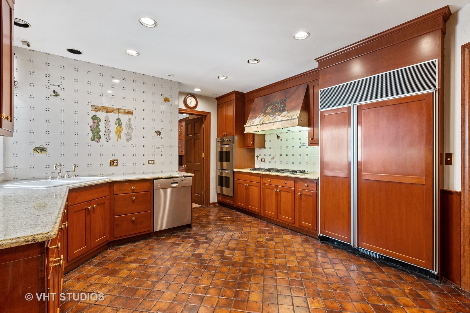 220 East Walton Place, Unit 9W Chicago, IL 60611 - Photo 9 of 22 a kitchen with stainless steel appliances granite countertop a refrigerator and a sink