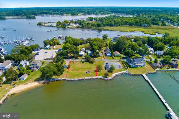 an aerial view of a houses with outdoor space