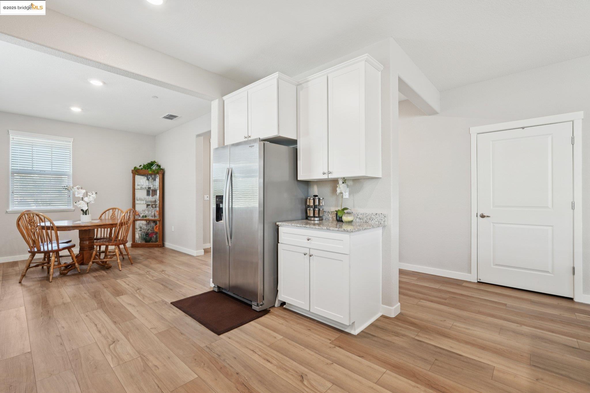 2119 Revival Lane Rio Vista, CA 94571 - Photo 11 of 44 a kitchen with stainless steel appliances a refrigerator and wooden floor