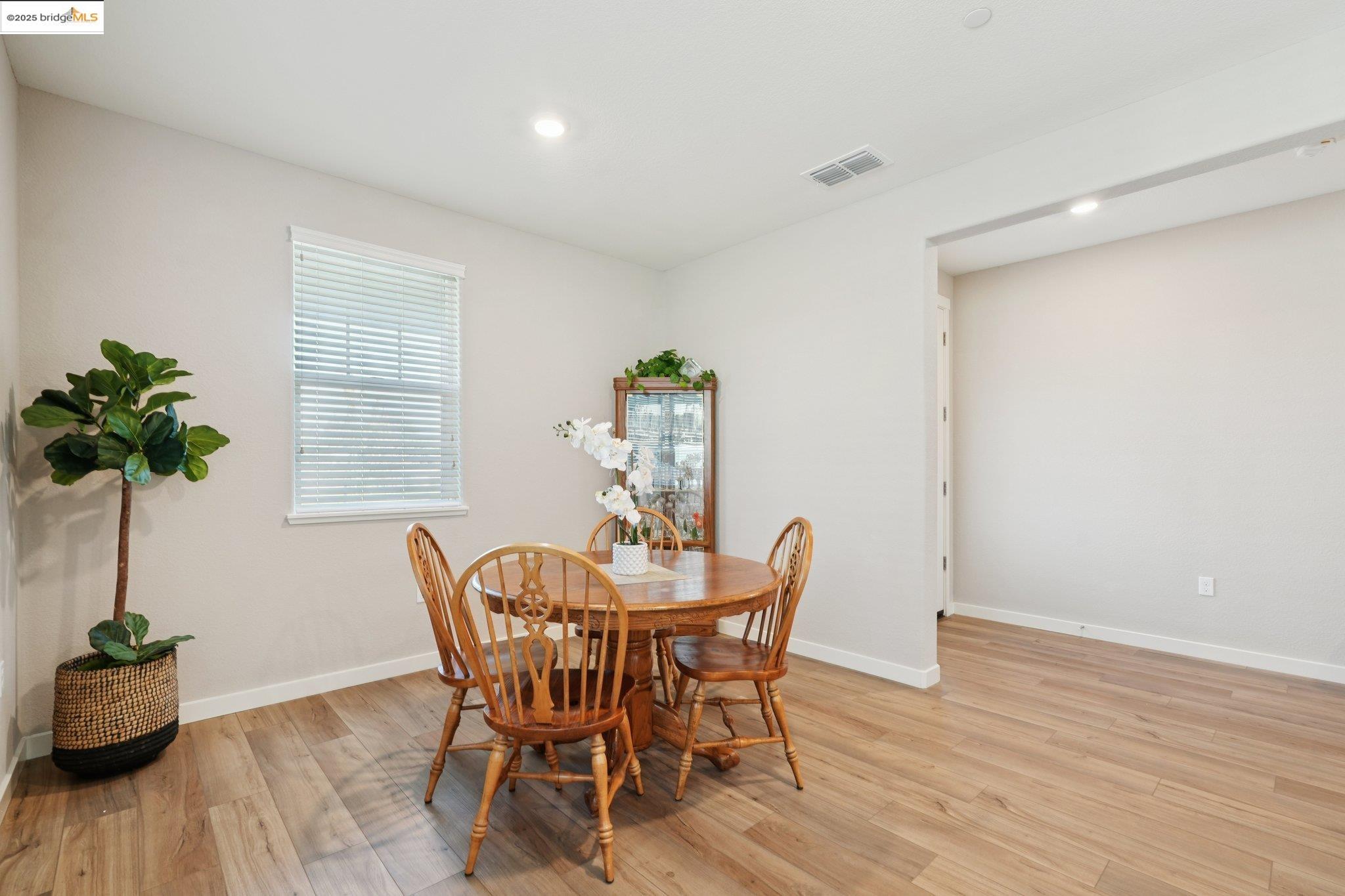 2119 Revival Lane Rio Vista, CA 94571 - Photo 13 of 44 a view of a dining room with furniture and a potted plant